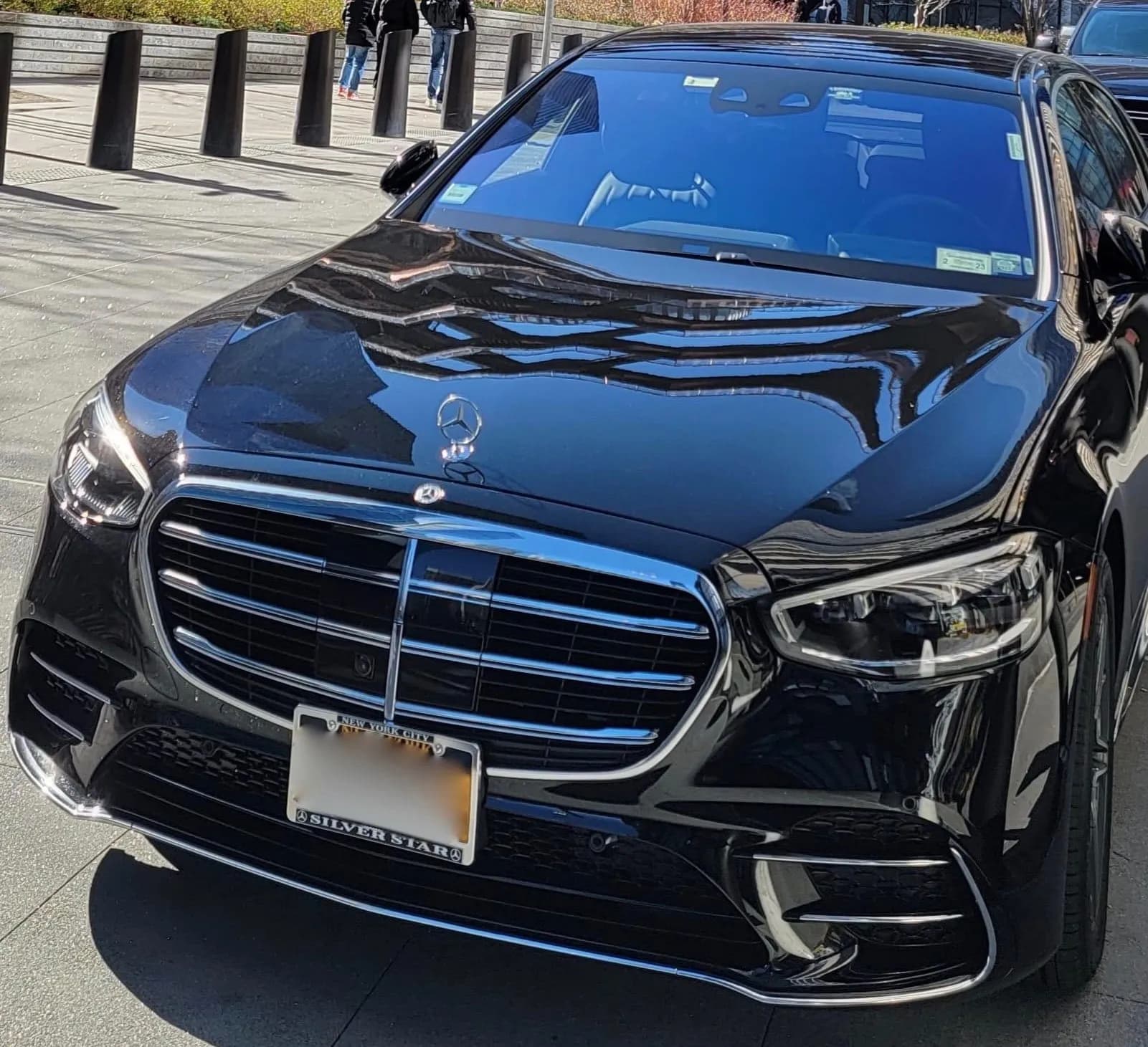Front grille of a black Mercedes S-Class sedan