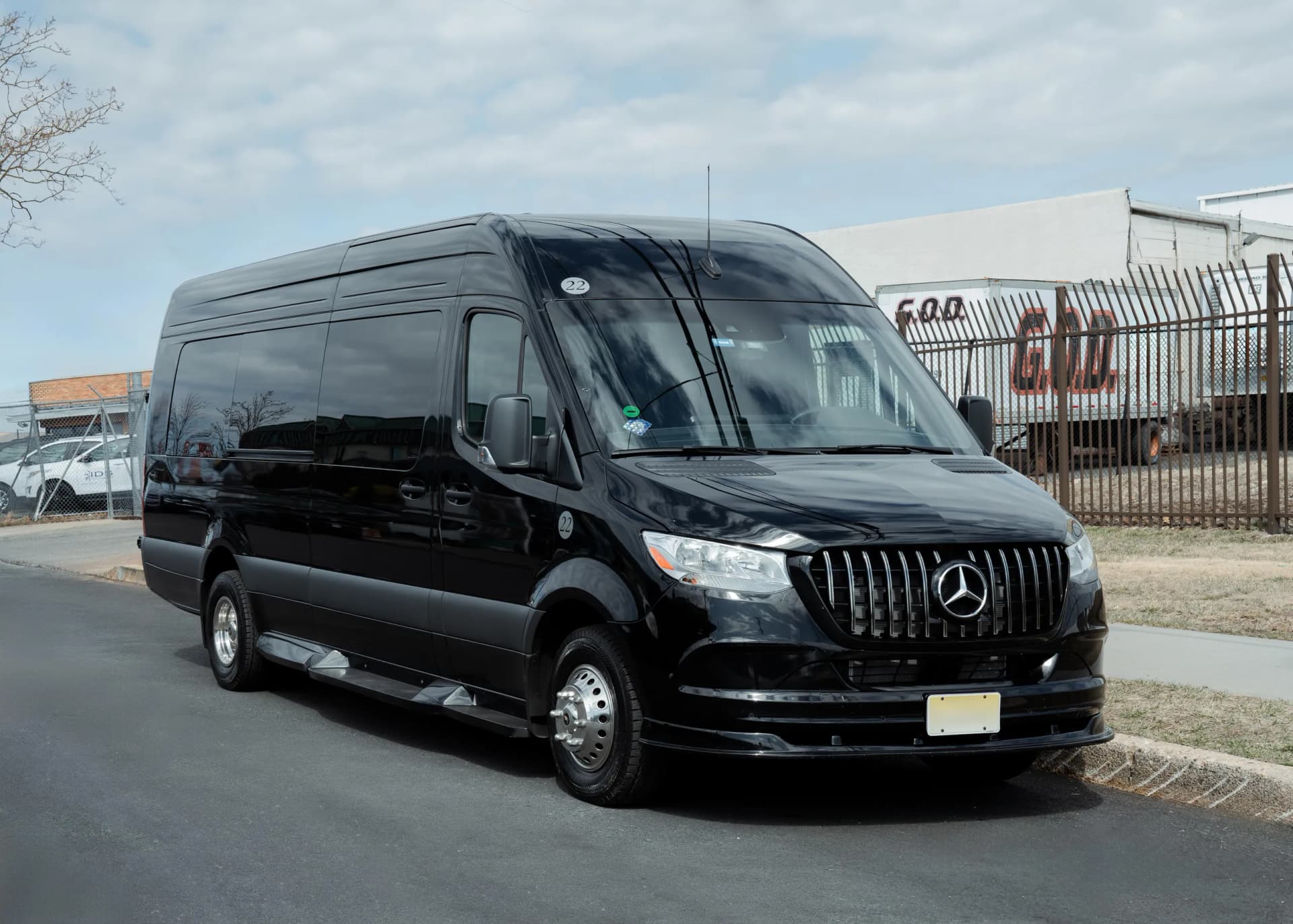 Black Mercedes Sprinter jet van, front three quarter exterior view