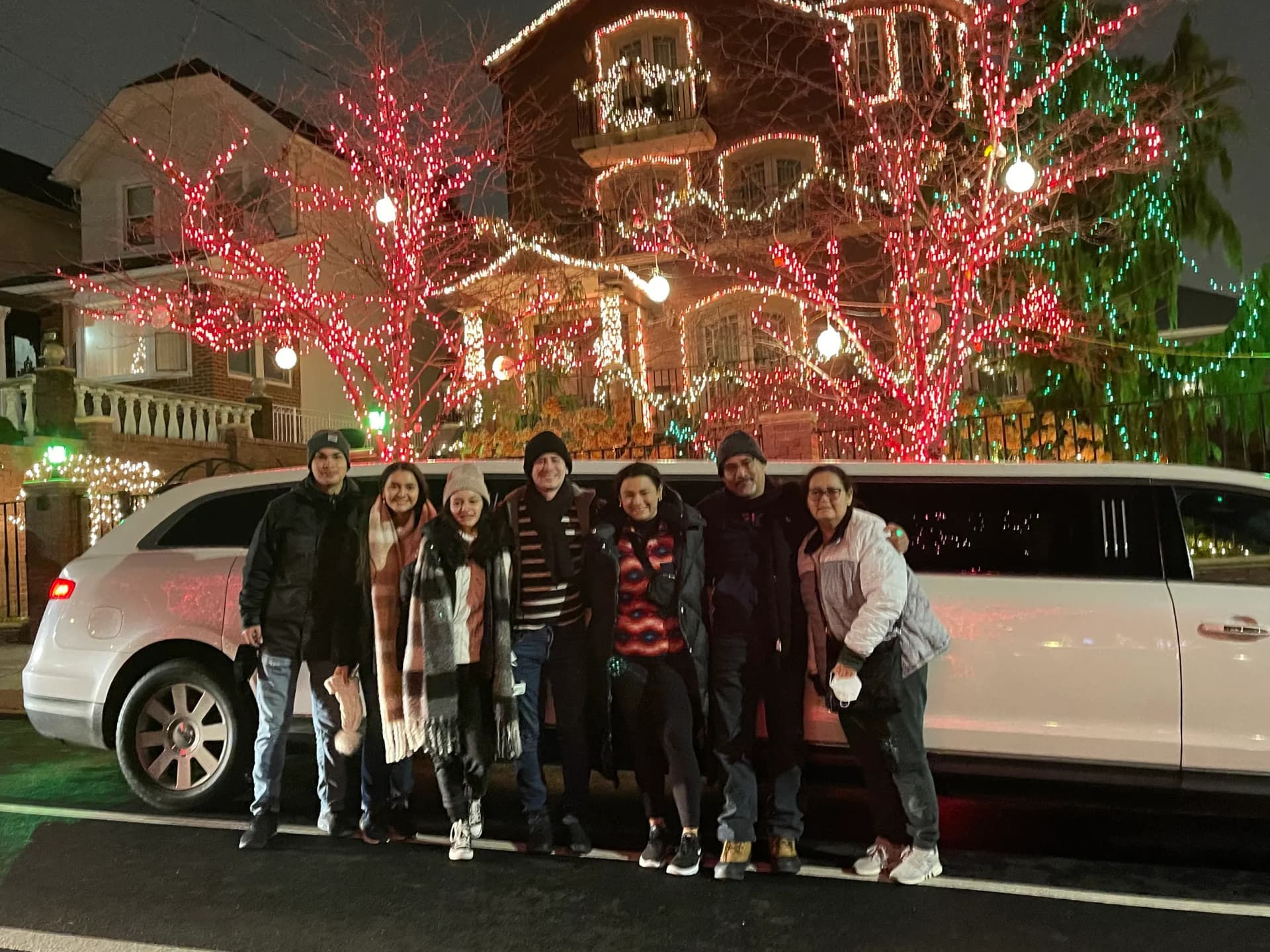 Friends on a Dyker Heights Christmas lights limo tour in Brooklyn