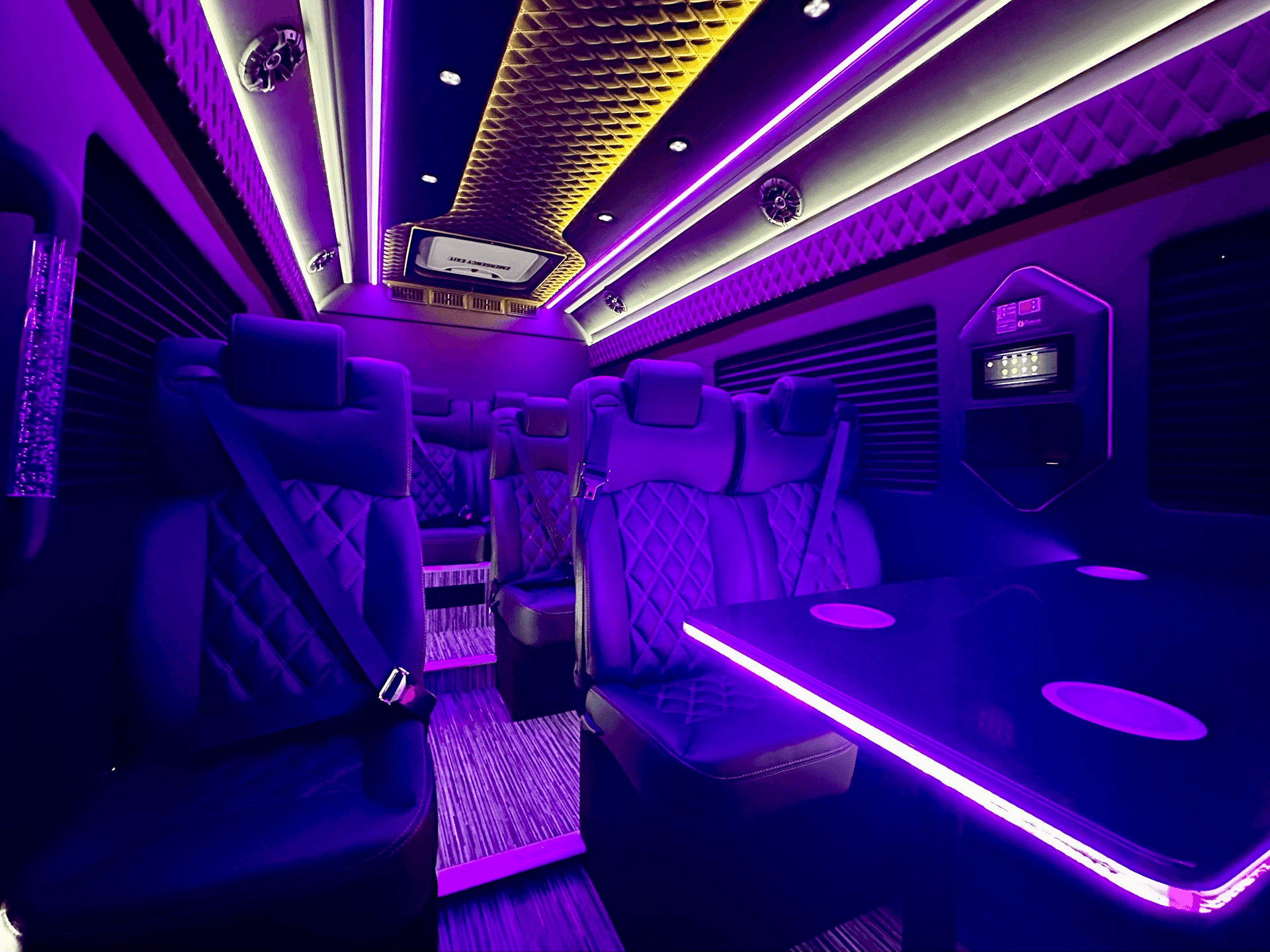 Mercedes Sprinter limo interior with purple LED lighting and quilted ceiling