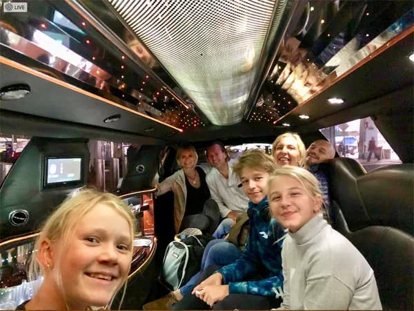 Family on a private New York tour inside a stretch limousine