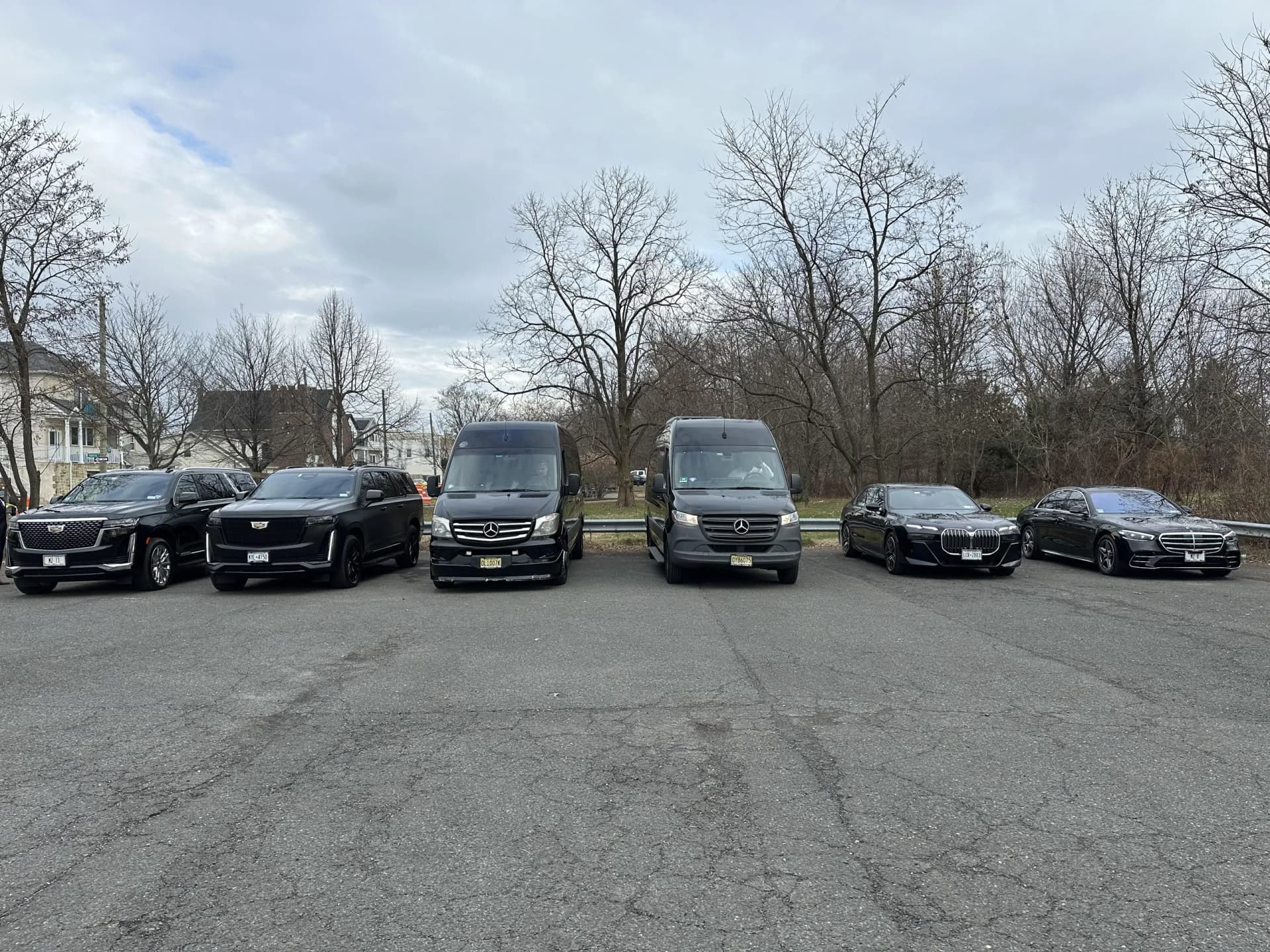 Cadillac Escalades, Mercedes Sprinters, BMW 7 Series and S-Class lined up