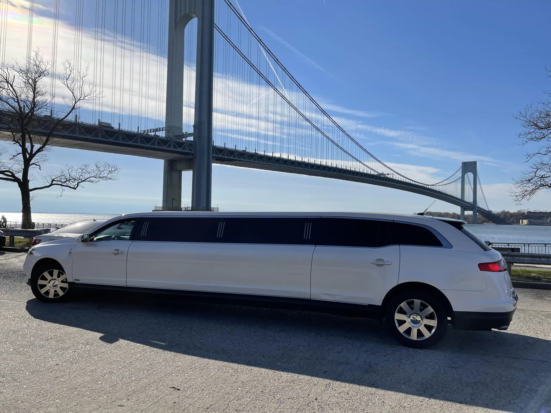 White Lincoln stretch limousine under the Verrazzano Bridge in Brooklyn