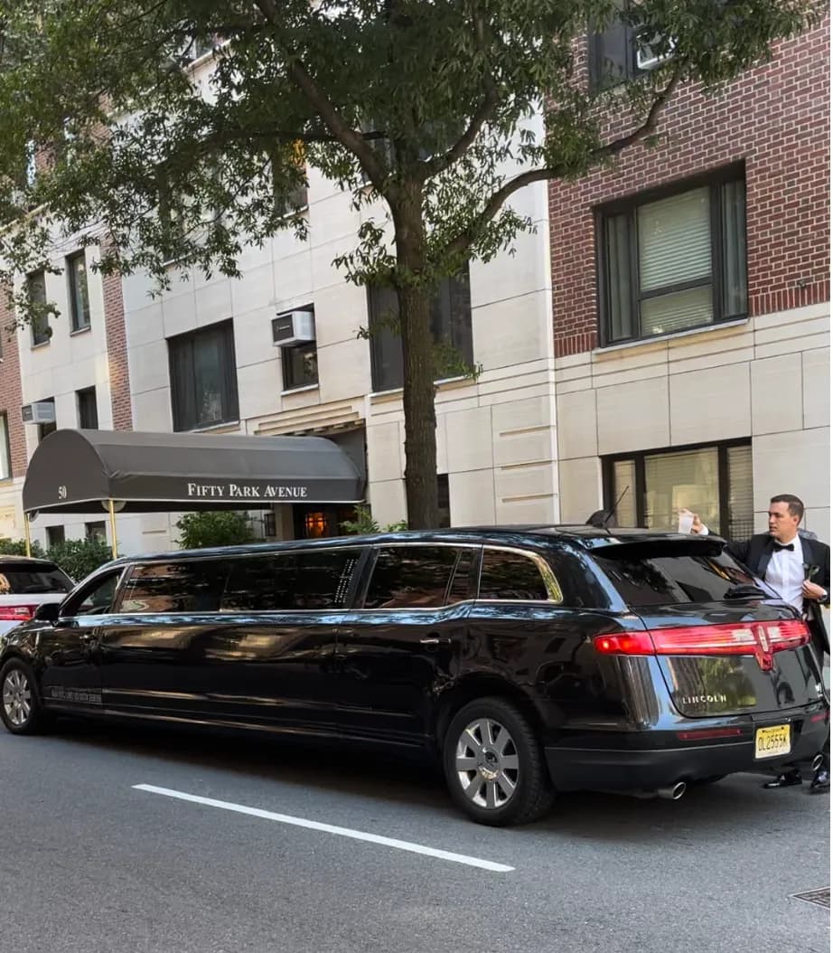 Black Lincoln stretch limousine arriving at Fifty Park Avenue