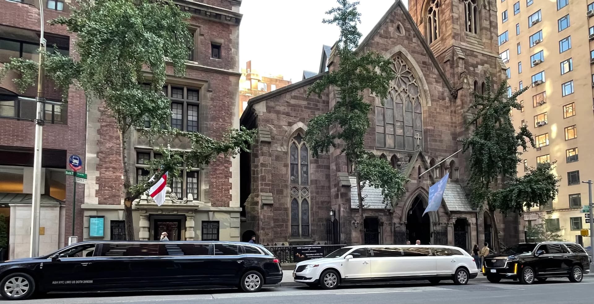 Black and white stretch limousines waiting outside a Manhattan church